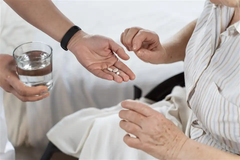 Patient in NDIS program taking medication | Joyfulness Care